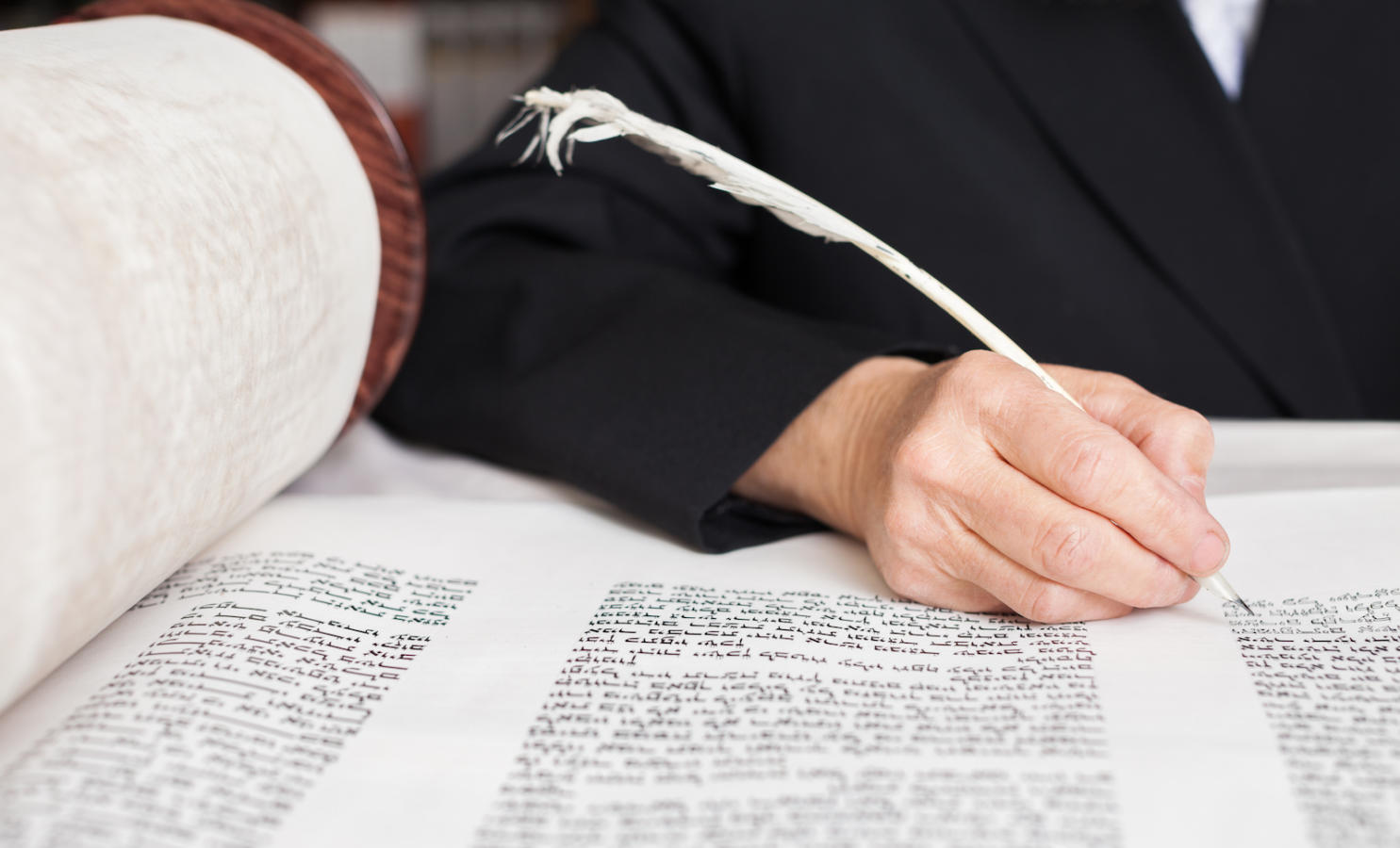 Scribe writing a Torah