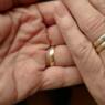 close up of hands with wedding rings