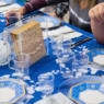 A traditional Passover seder table, featuring matzah, glasses of wine, and other traditional Passover foods.