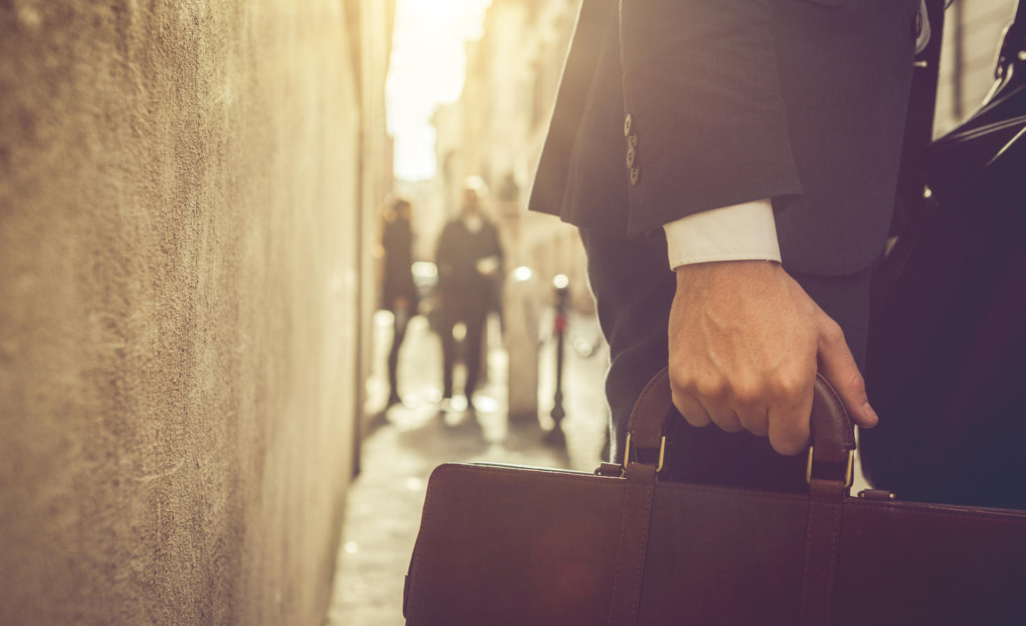 Business person walking with briefcase