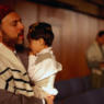 Jewish Man Holding Son and Praying