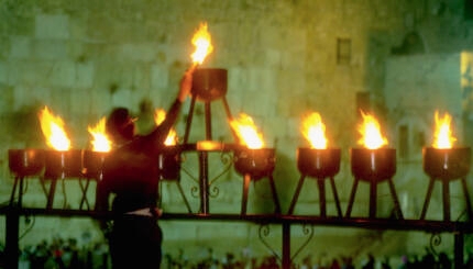 A giant Hanukkah menorah is lit near the Western Wall in Jerusalem, during the festival of Hanukkah. Israel.