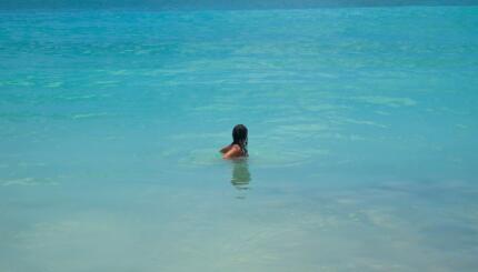 photo of a woman in an ocean