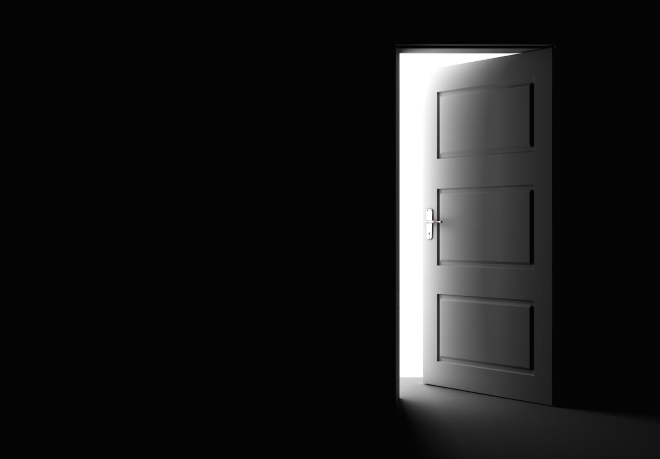 Open door in a dark room