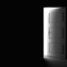 Open door in a dark room