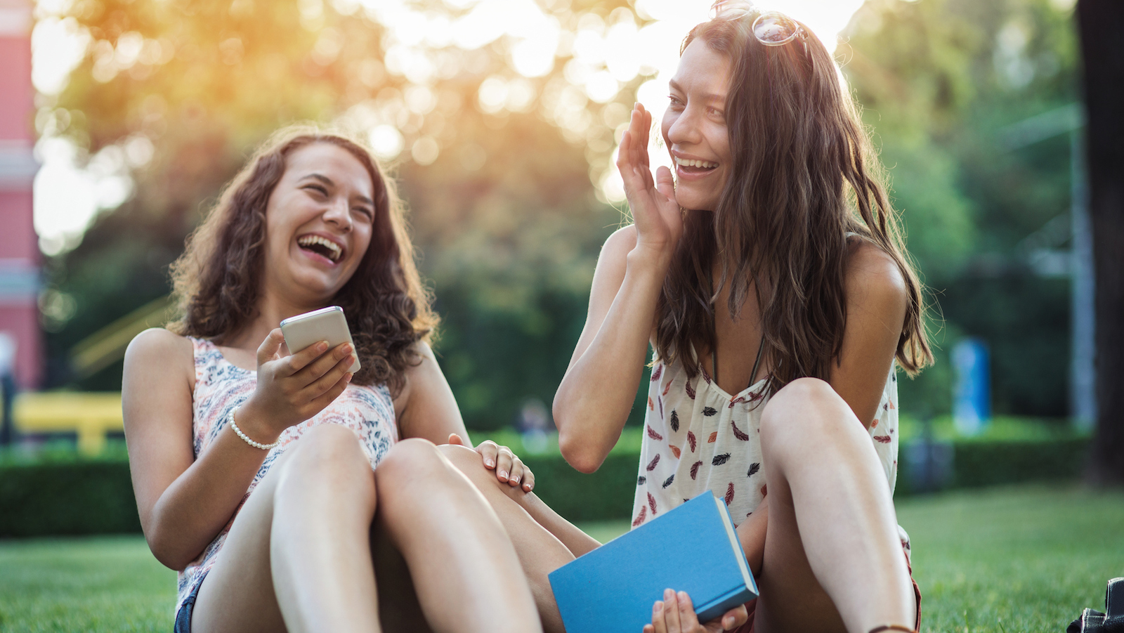 Sisters sitting. Laughing girl.