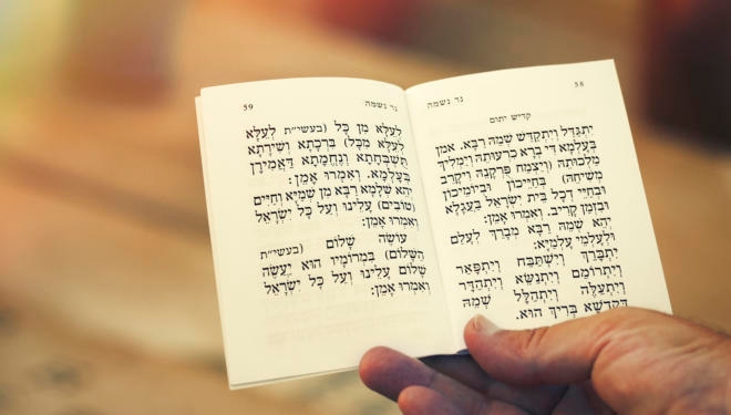 man holding kaddish prayer