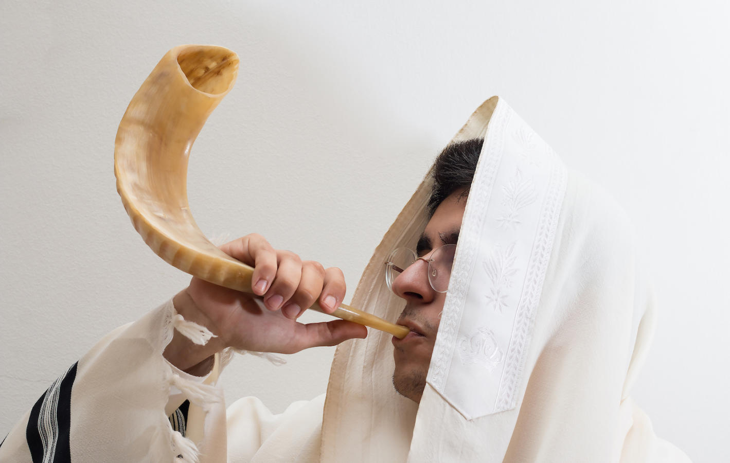 man blowing the shofar