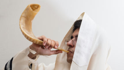 man blowing the shofar