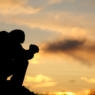 Silhouette of Unrecognizable Man Praying Outside