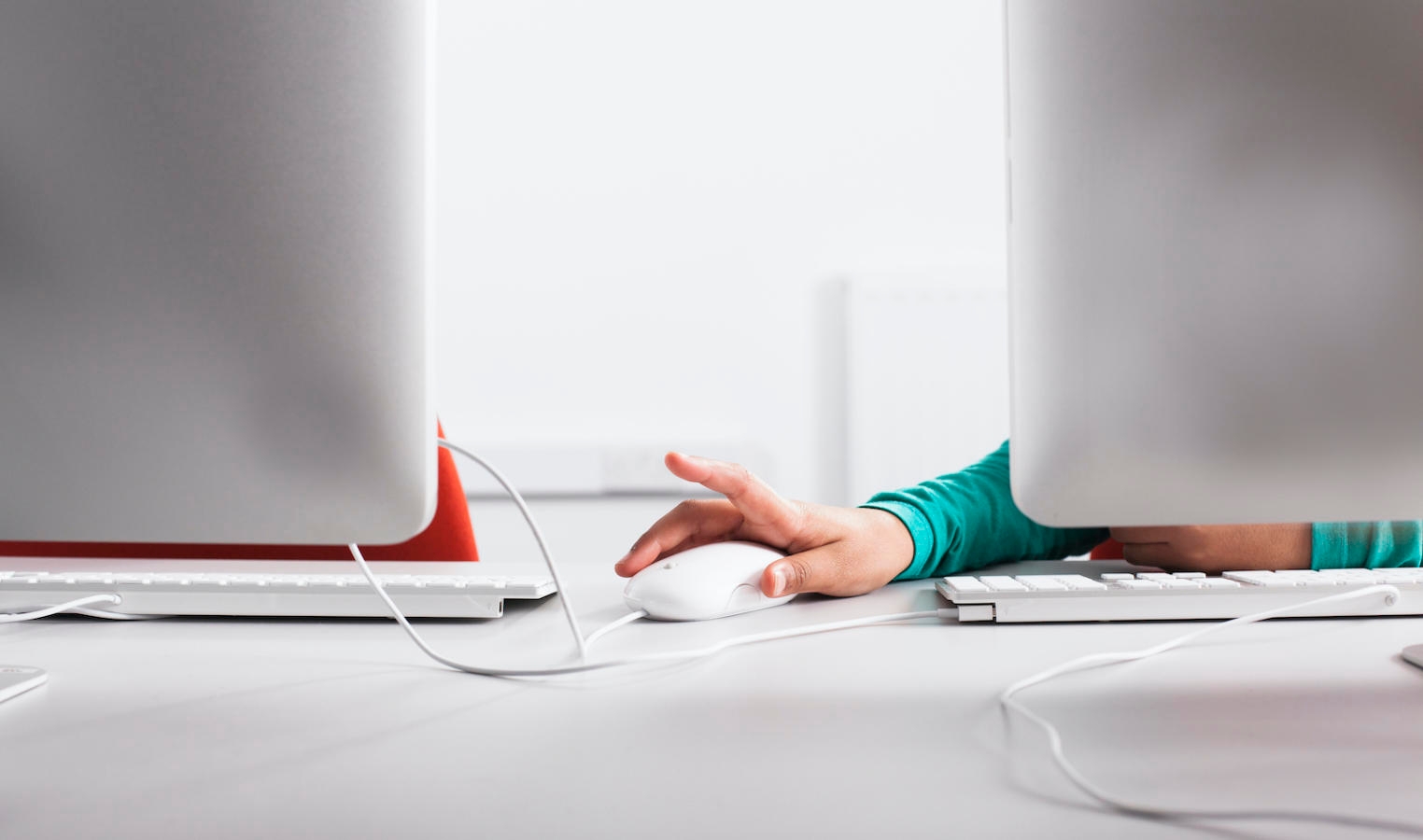 Girl using computer at desk