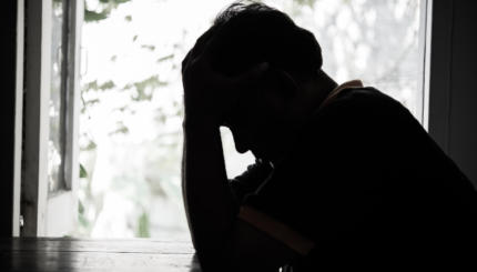 Silhouette Depressed Man Sitting At Table