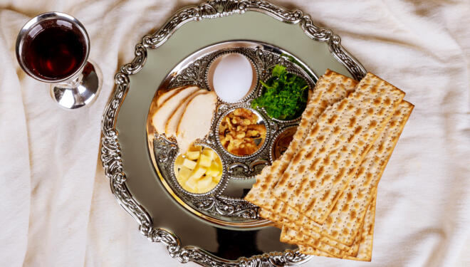 Pesah celebration concept jewish Passover holiday . Traditional pesah plate text in hebrew: Passover, egg,