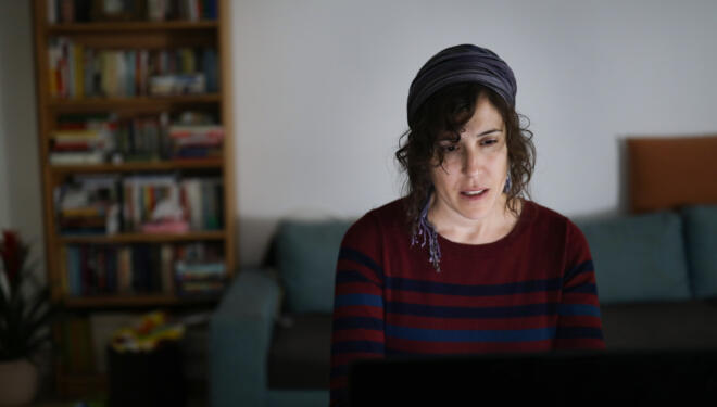 Woman working on her computer at home.