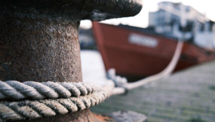 Close-Up Of Rope Tied To Wooden Post