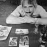 Photograph taken by Norman Gershman for BESA. This photograph is of Enver Alia Sheqer with family photos. His father was Ali Sheqer Pashkaj, one of the Albanian Muslims who rescued Jews during WWII.