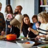 photo of a multi-generational family cooking dinner