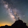 Silhouette of a person gazing at the sky.