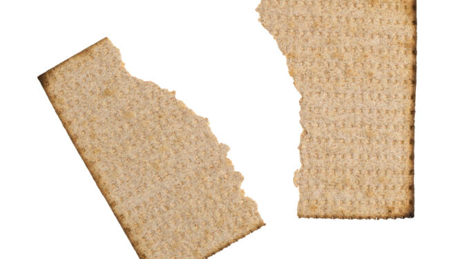 Piece of matzah broken in half.