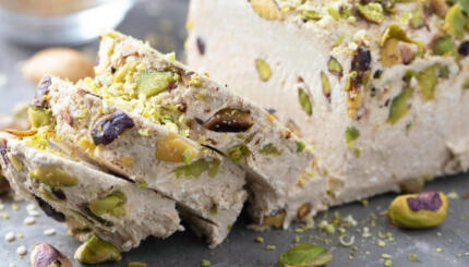 Sesame halva with pistachios recipe. Traditional middle eastern sweets. Jewish, turkish, arabic national dessert. Turkish delight.