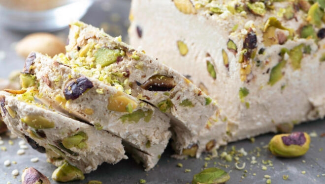 Sesame halva with pistachios recipe. Traditional middle eastern sweets. Jewish, turkish, arabic national dessert. Turkish delight.