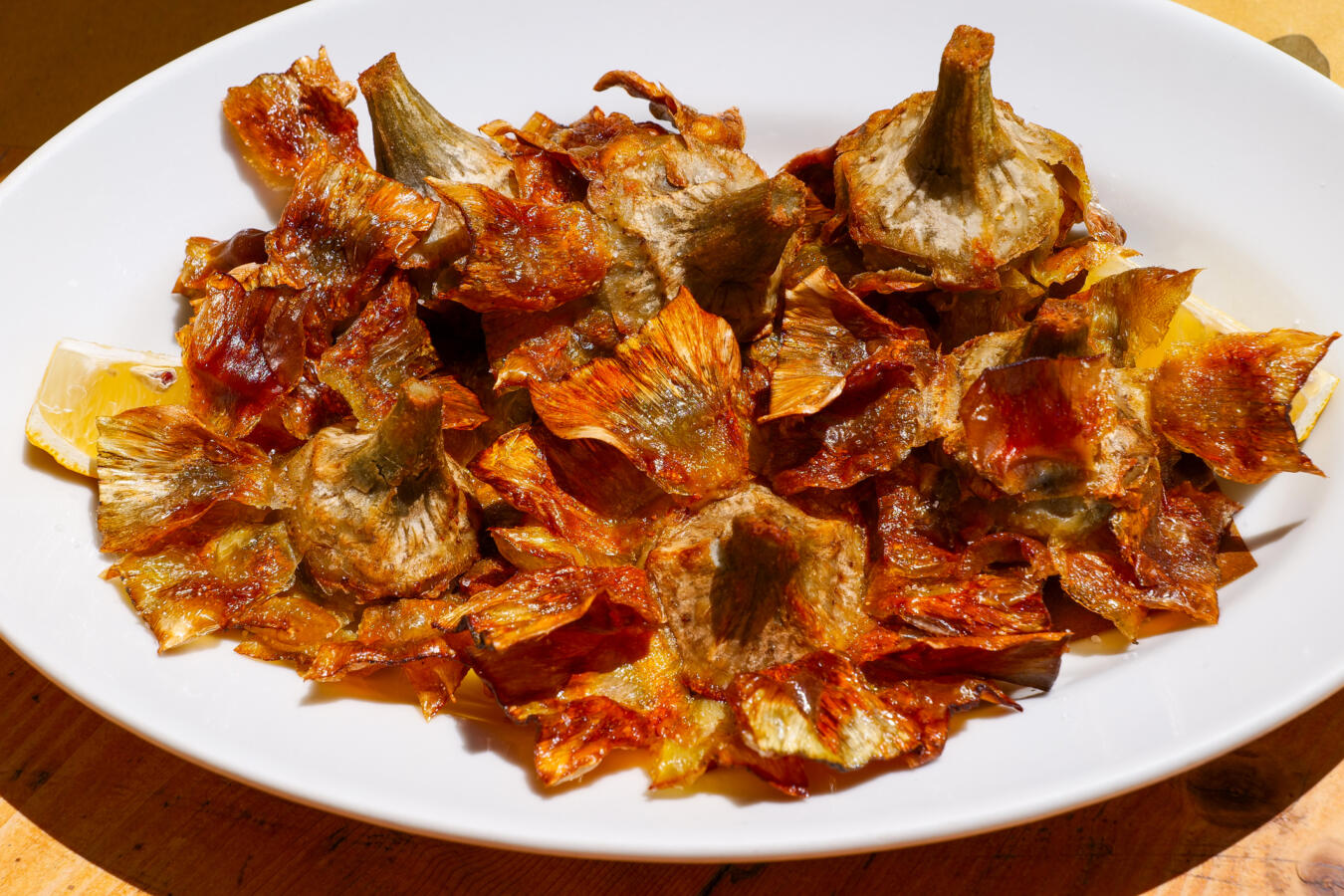 Rome, Italy - The traditional Italian cuisine is based on the Mediterranean diet, composed of natural and fresh products, including fruit, vegetables and cereals. In the photo: A typical dish of artichokes, coked according to the recipe of the Jewish Quarter of Rome (Roman Ghetto). Image in HD format.